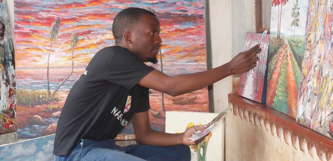 Malawian Artist, Charles Levison, at work.